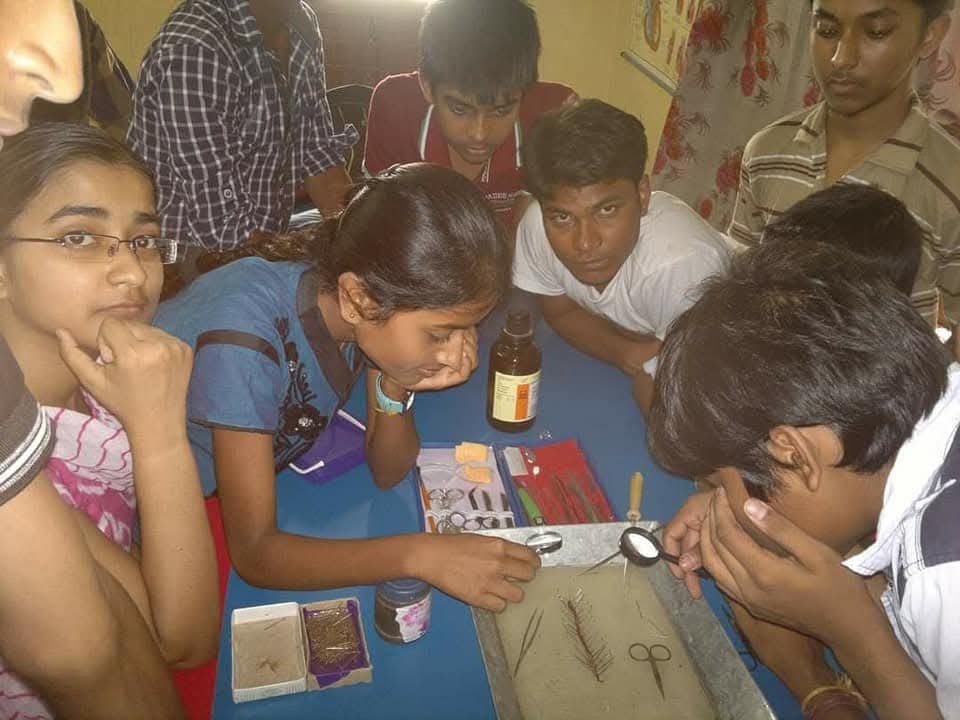 BIORTON students at a dissection tray with instruments