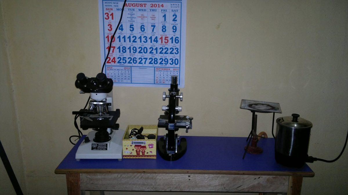 The BIORTON science lab bench with microscopes and a burner